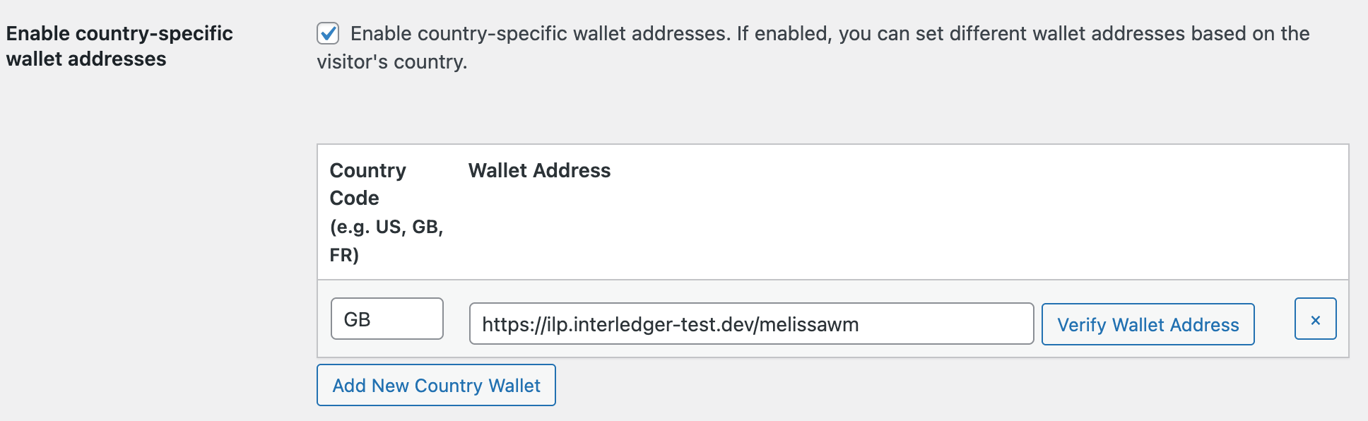 The option to enable country-specific wallet addresses is selected and the table shows an unverified wallet address assigned to country code GB